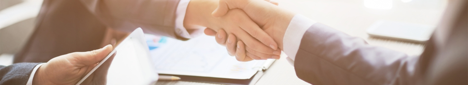 Business people shaking hands, finishing up a meeting